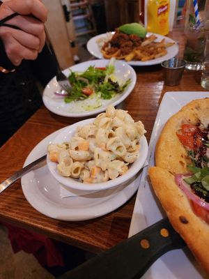 Mac salad and vegan side salad with green goddess and not pictured is a vegan garbage plate at The Gate House in Rochester