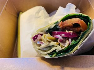 My favorite lunch- the Mediterranean wrap, made fresh at the Bfoods deli! Hummus, olives, veggies + and pickle! 🌯🥬🌶️🧅🥒  at Bloomingfoods Market and Deli - West Side in Bloomington