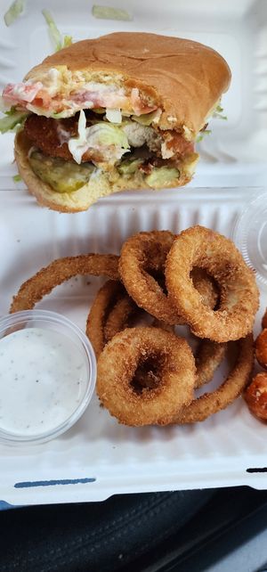 Chicken sandwich onion rings and sweet potato tots 😋 at Daily Veg in Wilmington
