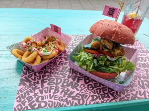 Onion rings, Daddy burger (imitates a chicken sandwich) at Vegan Junk Food Bar  - Rotterdam in Rotterdam
