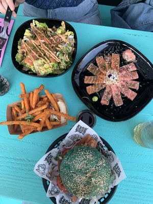 Sashimi mix, sashimi salad and chickn burger with sweet potato fries at Vegan Junk Food Bar  - Rotterdam in Rotterdam