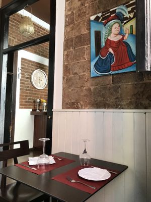 The place is cozy and has some Paintings un Boteros’s style, perhaps to prevent people from eating too much  at 18 Grados in Gran Canaria