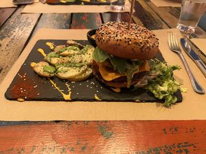 Red Dragon Burger with baked potatoes   at Sanissimo - Gran Via in Madrid