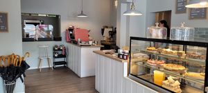 Entrée. Large room with tables beside the corner. at Mit Herz und Zucker in Hamburg