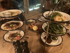 Different kinds of Mezze. Both on the top are not vegan. Vegan Options on the picture: hummus, Burned Aubergine, oven backed sweet potato & Falafel   at NENI in Cologne