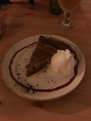 Pear tart with homemade vanilla ice cream and date sauce at MIMO in Malaga