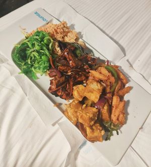 Black bean tofu, fried rainbow rice, seaweed + edamame, satay tofu and salt + chilli chips at Suissi Vegan Kitchen  in Glasgow