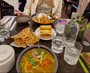 Top to Bottom: Katsu curry; Spring rolls; Lotus crisps; Mixed veg curry at Suissi Vegan Kitchen  in Glasgow
