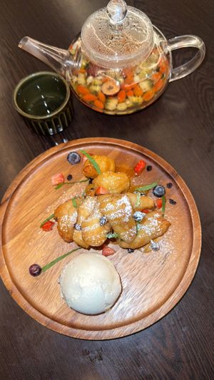 Jackfruit fritters and chrysanthemum and goji berry tea   at Suissi Vegan Kitchen  in Glasgow