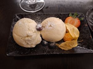 Honey dew melon scoop and a vanilla scoop of ice cream at Suissi Vegan Kitchen  in Glasgow