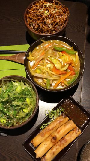 Noodles, vegetable curry, seaweed salad and spring rolls   at Suissi Vegan Kitchen  in Glasgow
