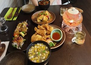 Hot sour soup, sweetcorn soup, Satay tofu skewers, salt chilli tofu, fried wontons and chrysanthemum goji berry tea at Suissi Vegan Kitchen  in Glasgow