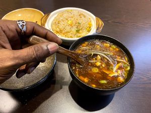 [Yes, I eat with my left hand sometimes, I even know how to use a chopped sticks with both hands, I just love the wood spoon. You taste the food better.] at Suissi Vegan Kitchen  in Glasgow
