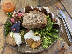 Falafel with side of kale/quinoa and side of smashed potatoes at Honest Greens - Serrano in Madrid