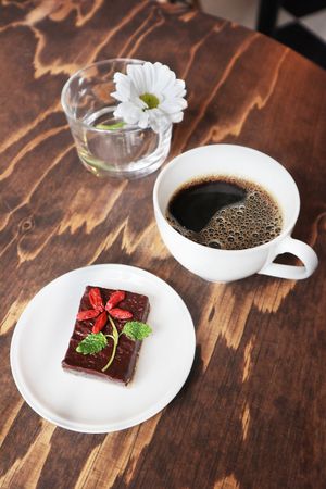 Beautiful rawfood chocolate and sea salt brownie with goji berries + coffee (oat milk available) 😍 at Shine Cafe in Stockholm