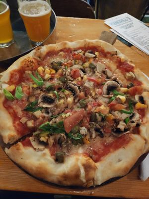 Vegan pizza with vegan cheese, seitan, mushrooms and vegetables at Mandrill Nano Brewing in Split