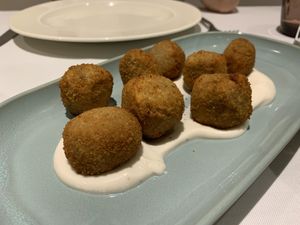Shiitake and portobello mushroom croquettes on aioli cream .   at Curcuma in Vigo