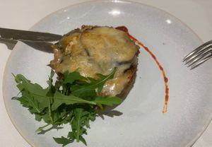 Tasty vegan moussaka garnished with rucola.   at Curcuma in Vigo