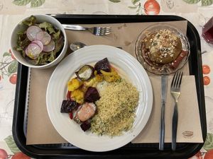Couscous, roasted vegetables, salad, and baked apple.  at A Praça in Sintra