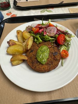 Veggie burger with potatoes and salad. at A Praça in Sintra