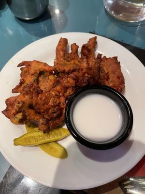Fried broccoli-onions in a chickpea batter, bjajia with coconut sauce at Natural Oasis Cafe in Rochester