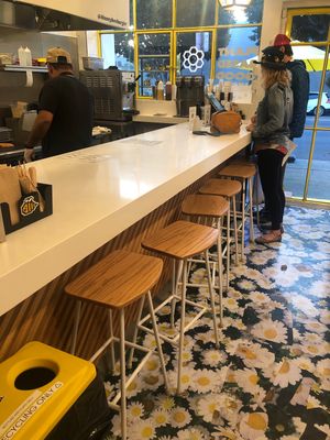 Indoor counter seating at Honeybee Burger in Los Angeles