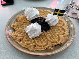 Vegan sweet waffle w/ coconut cream and blueberry jam at Älskade Traditioner in Stockholm
