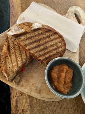 Vegan tosti met kikkererwten, harissa en gegrilde paprika..   at Back to Black in Amsterdam
