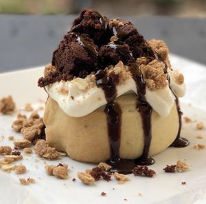 Vanilla Frosting, Brownie Bites, Pie Crumble & Chocolate Sauce! at Cinnaholic in Pearland