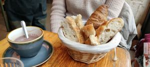 Hot chocolate and bread, croissant at Mōpa in Paris