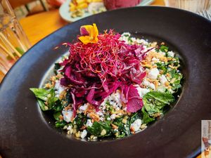 Dockside Salad
Spinach shoots, bulgur, chickpeas, pickled red cabbage, mint, chives, parsley, vegetable feta, citrus vinaigrette. at Mōpa in Paris
