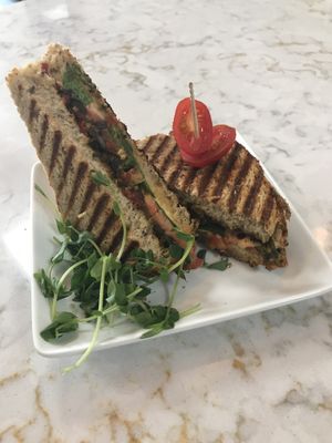 Made with Sun-dried Tomato Pesto, Fresh Spinach and Tomato slices, Sautéed Mushrooms, & Cashew Sour Cream. Served on a fresh baked 10 Grain Bread and warmed on a Panini Press. at Rawfully Yours Juice Bar & Cafe in Lasalle