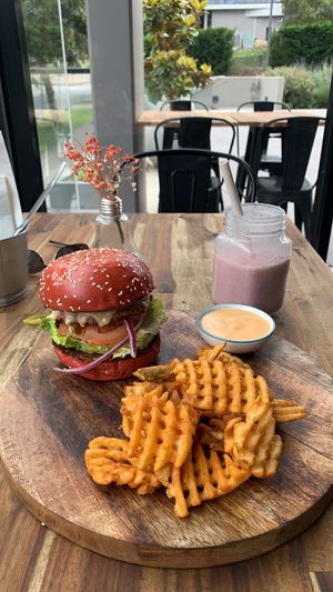 Cheese burger and waffle fries with a berry smoothie   at Lisica Cafe in Maribyrnong