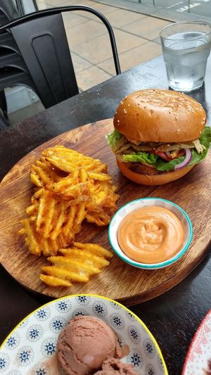 Chick'n burger with waffle fries and housemade spicy mayo sauce at Lisica Cafe in Maribyrnong