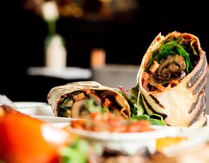 Vegan BBQ Breakfast Wrap with mushrooms, hash browns, sauteed onions, home made jackfruit bacon, spinach and home made bbq sauce at The Queens Head in Farnham