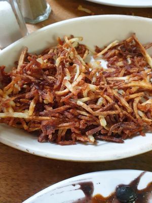 hash browns.. asked for well-done at Follow Your Heart Market & Cafe in Canoga Park