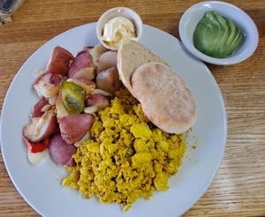 Breakfast Scramble: organic tofu, with mushrooms, onions, bell peppers, potatoes and housemate English muffin 😋 at Follow Your Heart Market & Cafe in Canoga Park