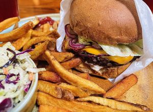 Multi grain veggie burger, crispy fries and house made coleslaw✨ delicious   at Follow Your Heart Market & Cafe in Canoga Park