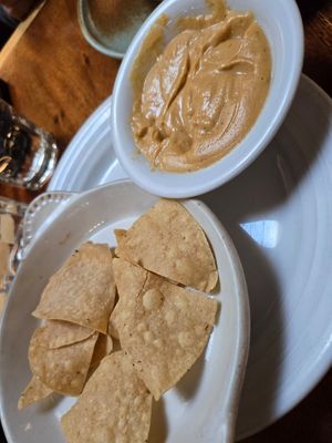 Nacho cheese sauce with chips 😊 at Follow Your Heart Market & Cafe in Canoga Park