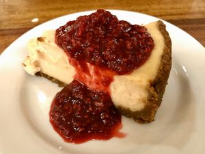 Vegan cheesecake with raspberry sauce. So Delicious! at Follow Your Heart Market & Cafe in Canoga Park