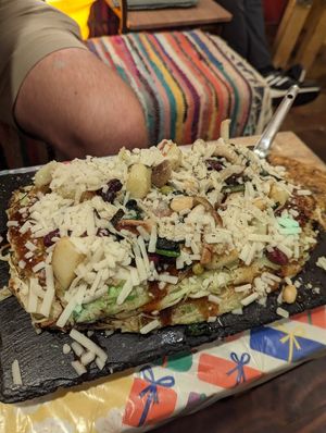 HUGGGE okinomiyaki with vegan cheese at OKO Okonomiyaki in Osaka