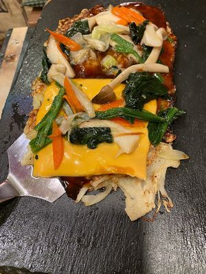 Okonomiyaki with cheddar cheese at OKO Okonomiyaki in Osaka