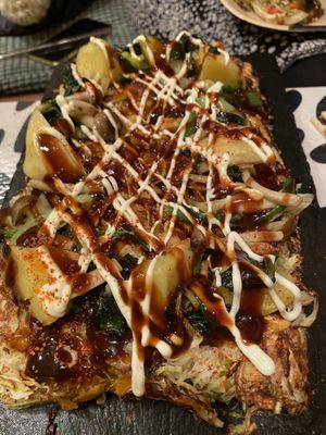 The Okonomiyaki after the mandatory saucing and not mandatory (but recommended) spice adding at OKO Okonomiyaki in Osaka