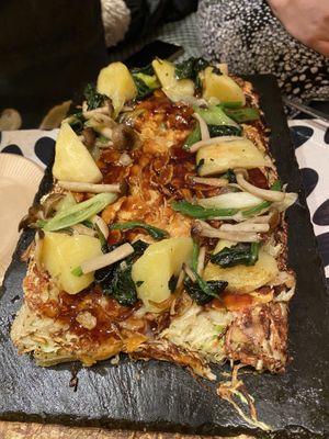 The Okonomiyaki delivered to you. Mine has potato, two types of mushroom, spinach and long onions at OKO Okonomiyaki in Osaka