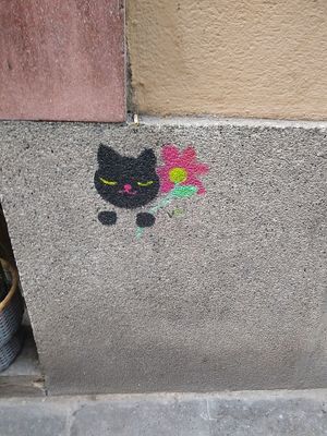 Drawing next to the entrance at CactusCat Bar in Barcelona