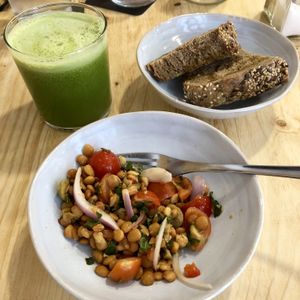 lentil salad, bread, green juice at CactusCat Bar in Barcelona