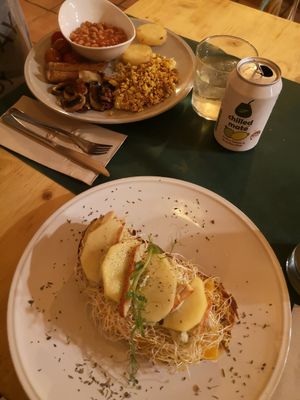 Cheese and apple toast and English breakfast in the back at CactusCat Bar in Barcelona