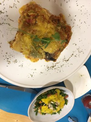 Lasagna that comes with a side salad  at CactusCat Bar in Barcelona
