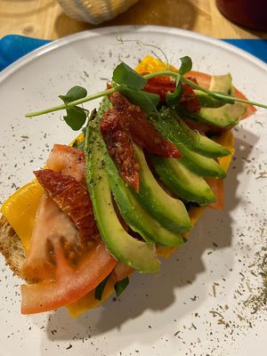 avocado toast with vegan cheese and sundried as well as fresh tomatoes at CactusCat Bar in Barcelona