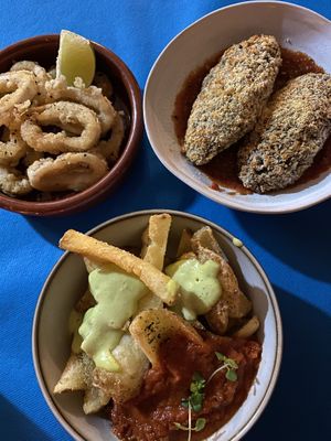 Konjak rings, quinoa croquettes and patatas bravas. Typical tapas, vegan style! at CactusCat Bar in Barcelona